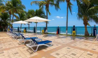 High floor corner unit beach front with sunrise!