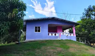 Large plot of land with a small house in Boquerón